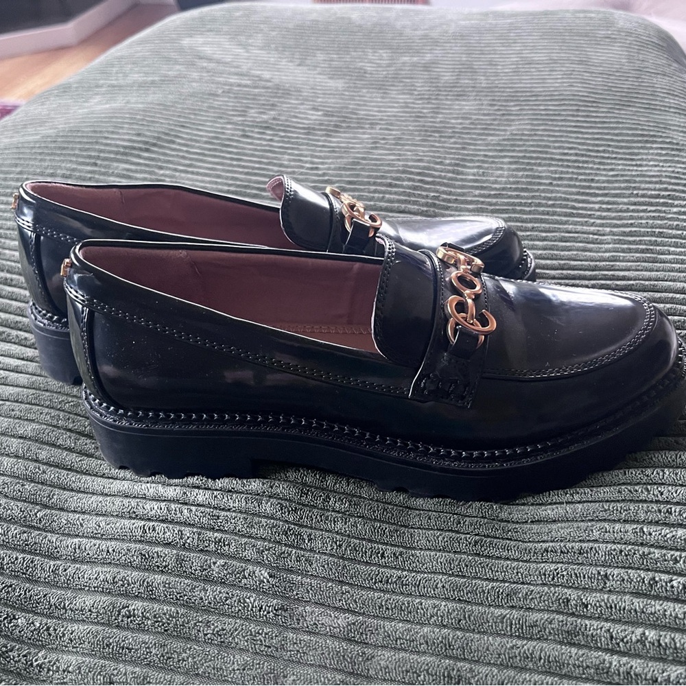 Shiny black loafers